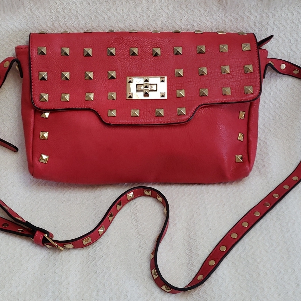 RED studded-embellished lipstick red vegan leather shoulder bag